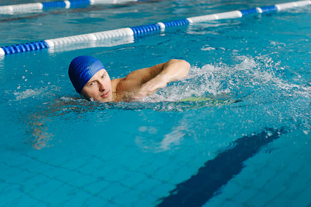 istock Young sportsman swimming in pool 637977568