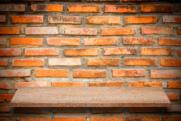 istock Empty top of natural stone shelves and stone wall 637977742