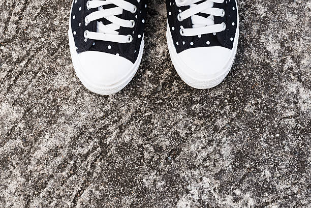 istock black and white dot woman sneakers 637978820