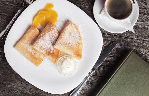 istock Crepes with cream and coffee breakfast 637980524