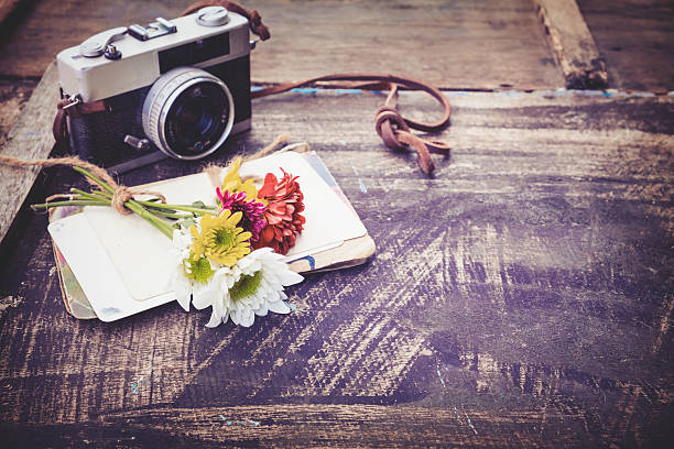 istock Vintage camera with bouquet of flowers 637981134