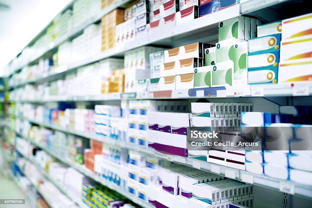 Trusted brands to treat your symptoms Shot of shelves stocked with various medicinal products in a pharmacy Pharmacy Stock Photo