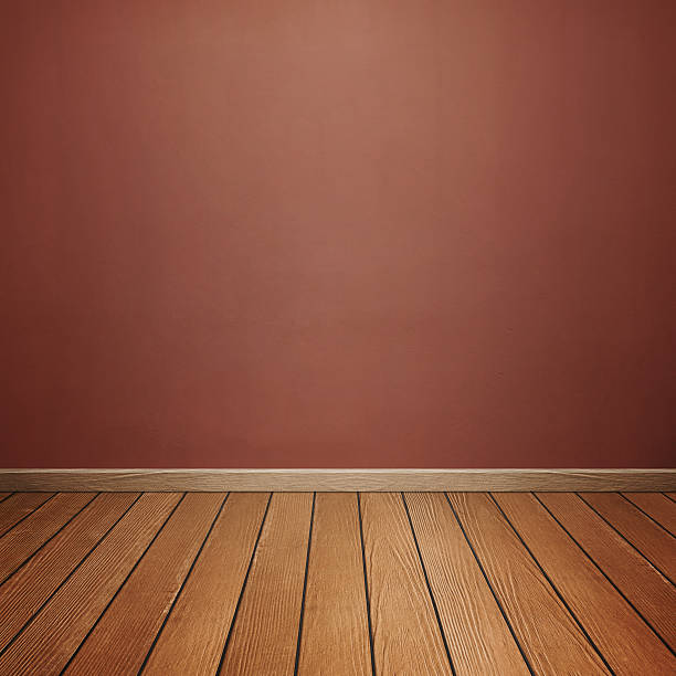 istock room interior with concrete wall and brown wood floor 637982340