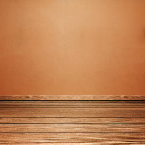 istock room interior with concrete wall and brown wood floor 637983814