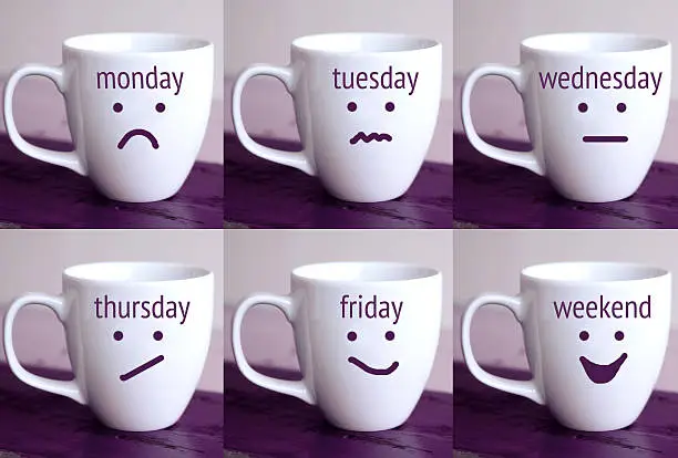 six cups with the words of days of the week and drawn faces