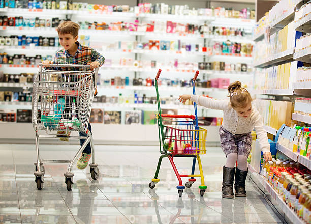 Children shopping indepartment store stock photo