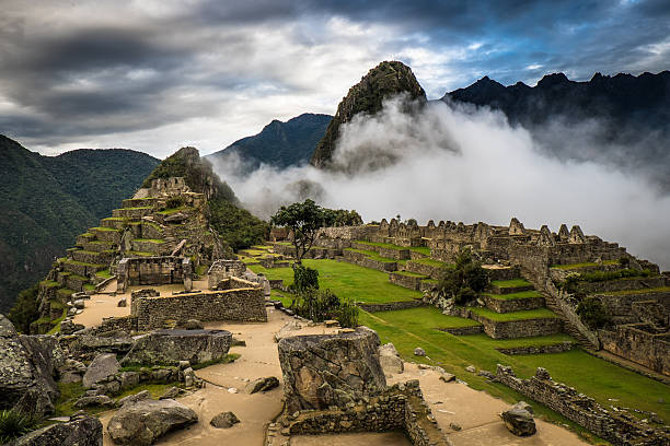 Machu Picchu at Sunrise and Clouds Machu Picchu  at early morning peru city stock pictures, royalty-free photos & images