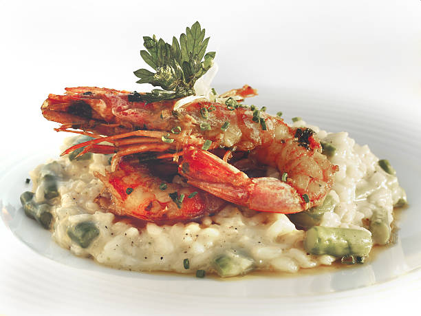 istock Risotto with prawns in a bowl on a light background. 637991580