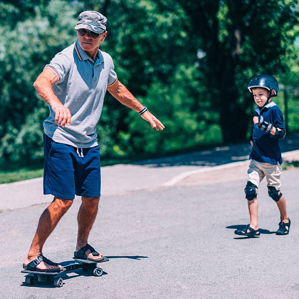 istock Grandfather and grandson having fun, snakeboarding 637992170