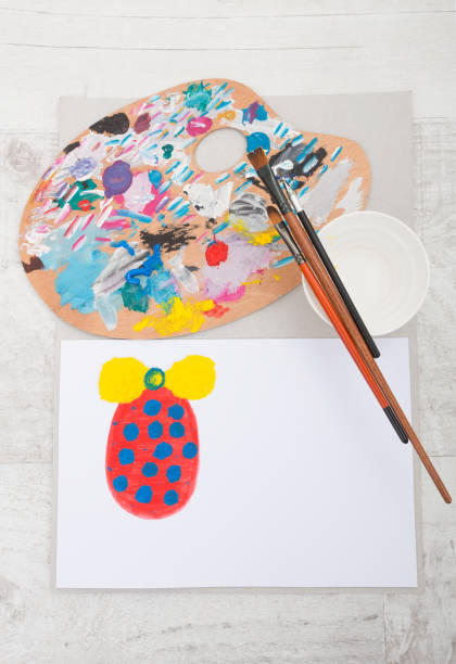 istock Dirty brushes with  art pallete and egg on paper 637993600