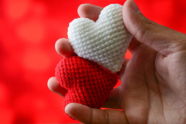istock Pick red and white heart with red background 637994098