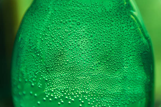 istock Oxygen bubbles in the bottle with water or drink. 637994490