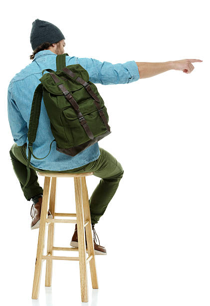 istock Rear view of hipster pointing away 637994542