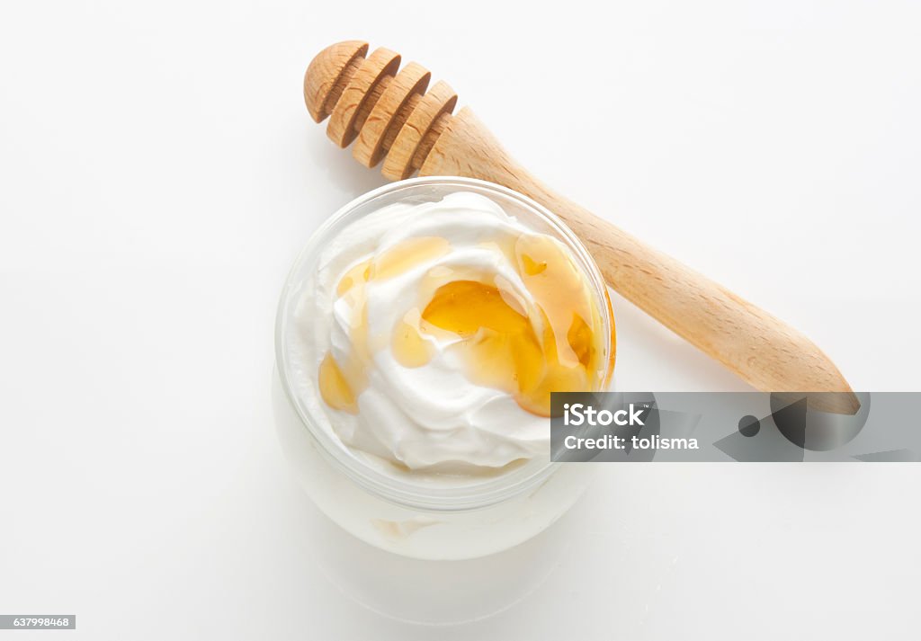 greek yogurt with honey greek yogurt with honey, top down view, isolated on a white background Yogurt Stock Photo