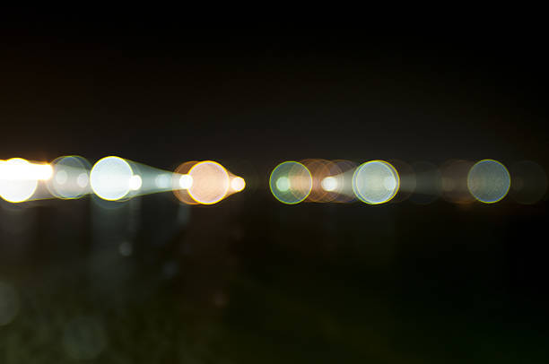 abstract photo, street lights at night on the seaabstract photo, street lights at night on the seaabstract photo, street lights at night on the sea seen from a beach in Italy