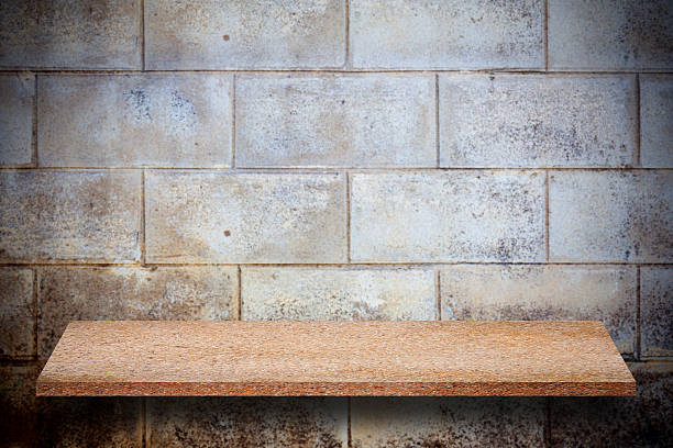 istock Empty top of natural stone shelves and stone wall 638000790