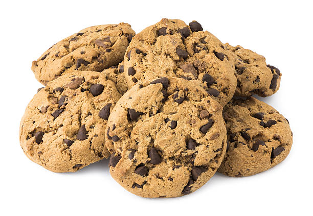 Pile of Chocolate Chip Cookies Isolated on White Background Pile of Chocolate Chip Cookies Isolated on White Background chocolate chip cookie stock pictures, royalty-free photos & images