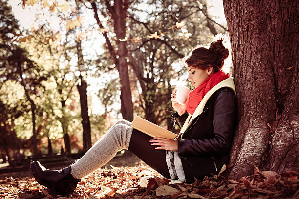 istock Girl leaning on a tree in the park. 638002244