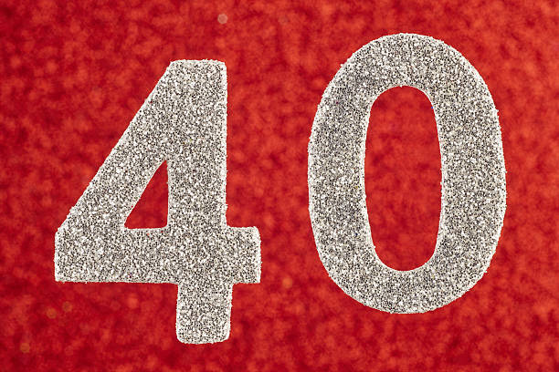 istock Number forty white color over a red background. Anniversary. 638002724