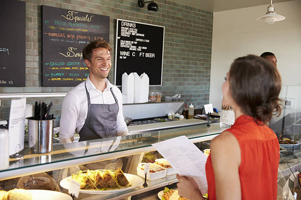 istock Man Working Behind Counter In Delicatessen Taking Food Order 638005000