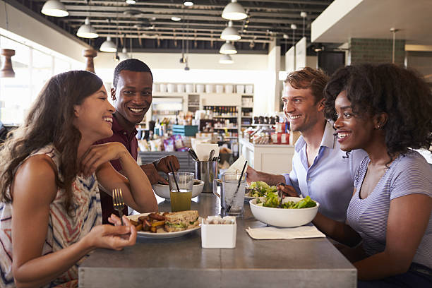 istock Friends Enjoying Lunch Date In Delicatessen Restaurant 638005136