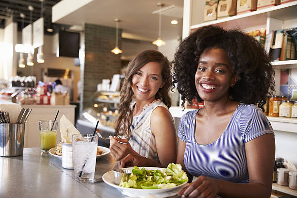 istock Two Women Enjoying Lunch Date In Delicatessen Restaurant 638005168