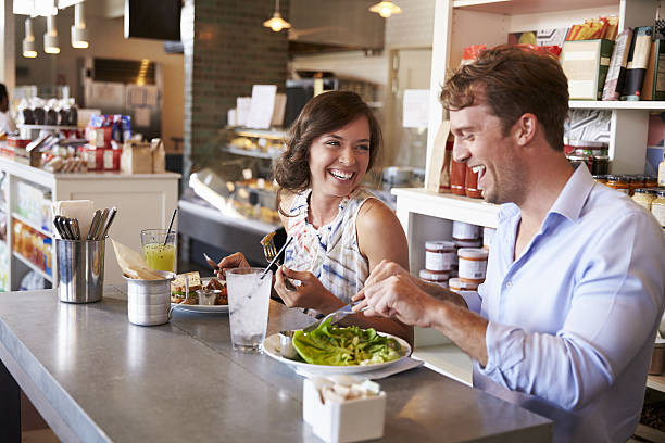 istock Couple Enjoying Lunch Date In Delicatessen Restaurant 638005256