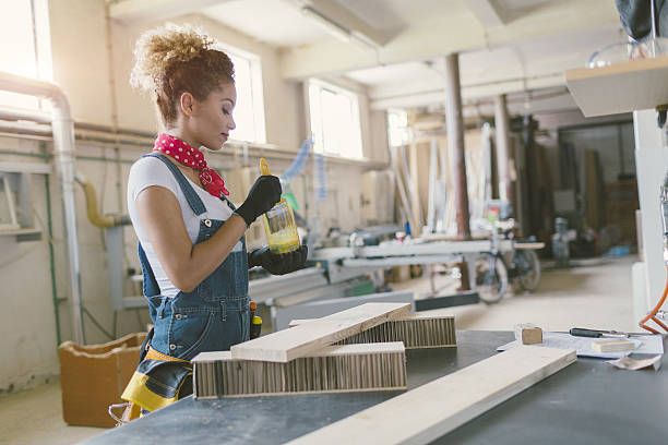 istock Latin Carpenter Painting Plank. 638005424