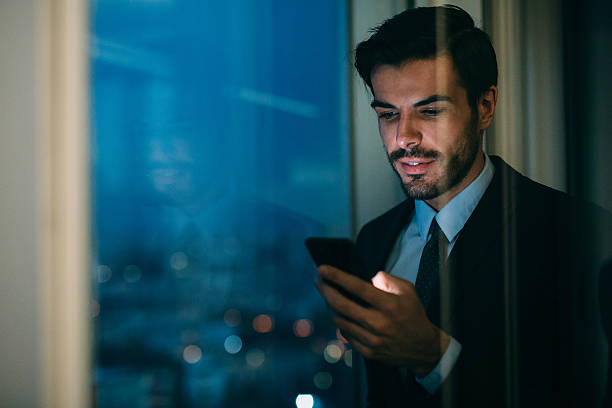 istock Buisnessman Texting On The Phone 638005640