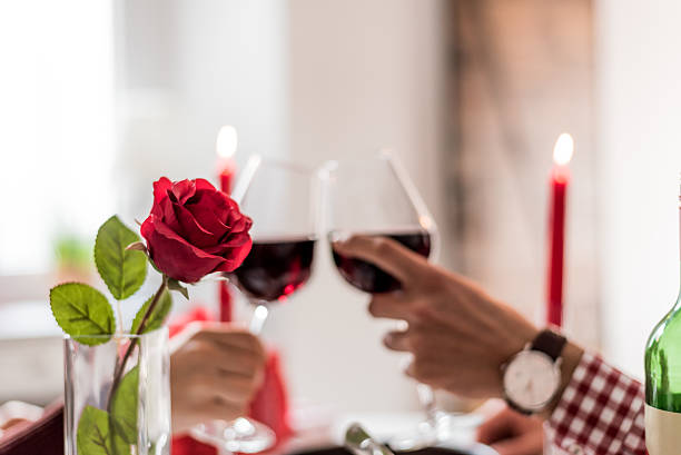 istock Couple celebrating Valentine's day with dinner at home drinking wine 638006482