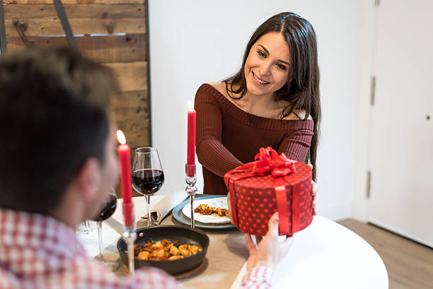 istock Couple celebrating Valentine's day with dinner at home drinking wine 638007758