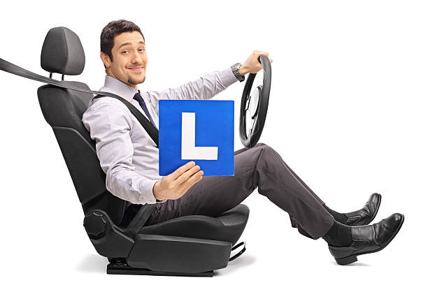 istock Guy sitting on a car seat and holding an L-sign 638008114