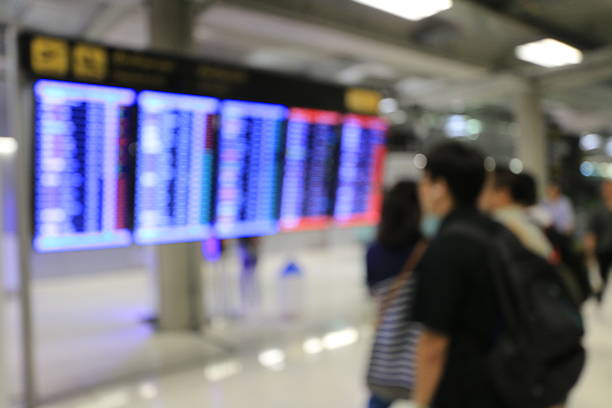 istock blur image of blue screen flight schedules  in airport 638010712