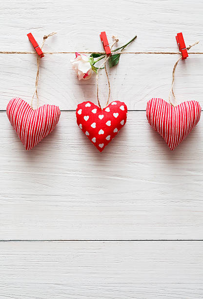 istock Valentine day background, pillow hearts border on wood 638011330