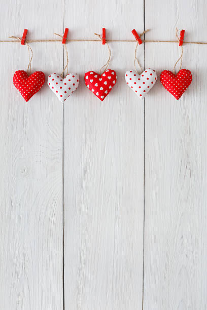 istock Valentine day background, pillow hearts border on wood, copy space 638011824