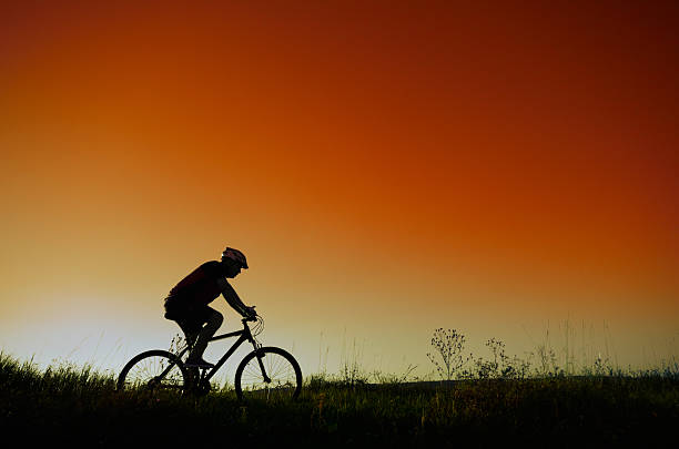 istock Male cyclist driving outdoors 638012390