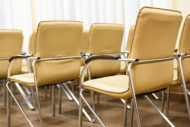 istock Rows of metal chairs at the conference in an empty 638013968