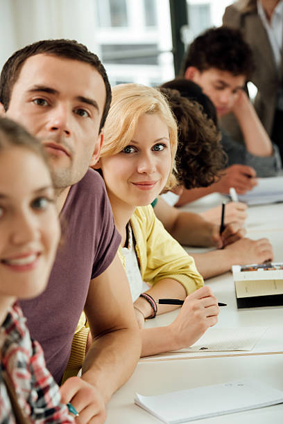 istock Portrait of university students in classroom 638014040