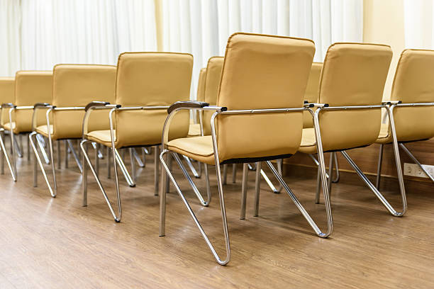 istock Rows of metal chairs at the conference in an empty 638014700