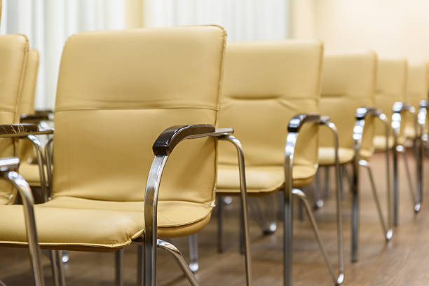 istock Rows of metal chairs at the conference in an empty 638015072