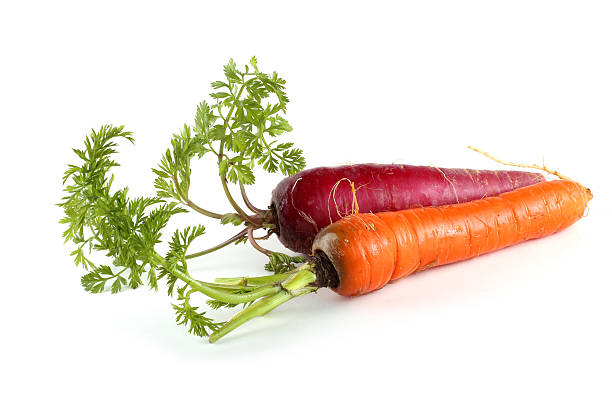 istock Red and orange carrots with leaves 638015492