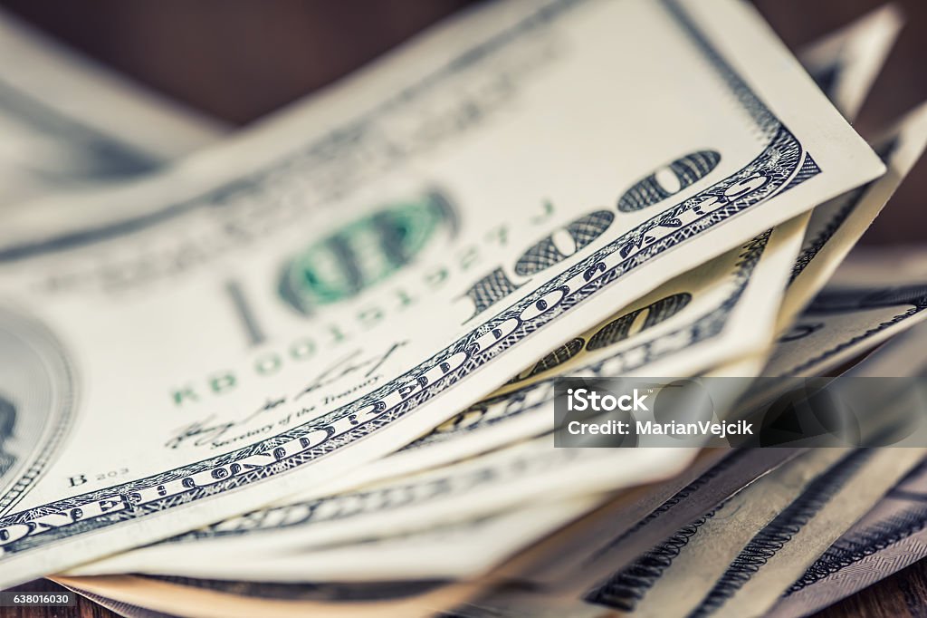 Dollars.Close-up view of stack of US dollars. Cash American Dollars. Dollars banknotes closeup. Cash Money American Dollars.Close-up view of stack of US dollars.Dollars banknotes closeup. Cash Money American Dollars.Close-up view of stack of US dollars. Coin Stock Photo