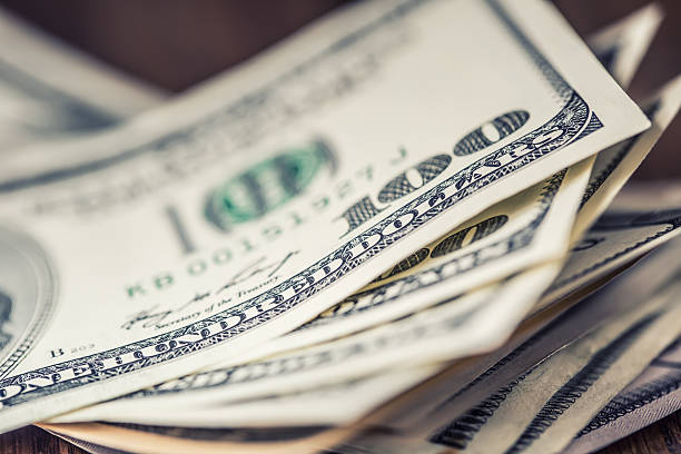 Dollars.Close-up view of stack of US dollars. Cash American Dollars. Dollars banknotes closeup. Cash Money American Dollars.Close-up view of stack of US dollars.Dollars banknotes closeup. Cash Money American Dollars.Close-up view of stack of US dollars. abundance stock pictures, royalty-free photos & images