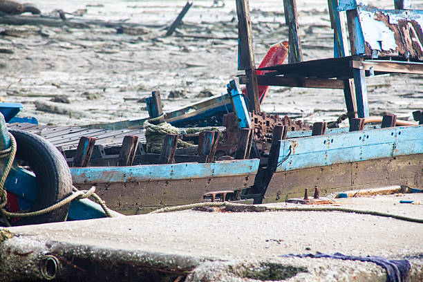 istock Broken abandoned fishing boat by the shore 638017690