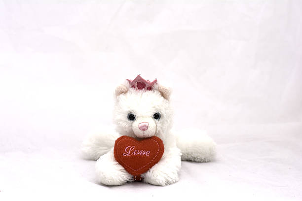 istock dog doll with red heart on white background 638021074