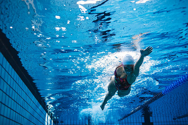istock Fit female athlete swimming in pool 638024664
