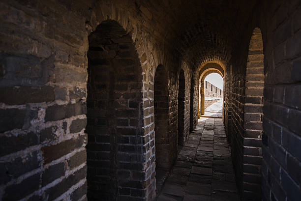 istock long stone corridor with stairway in ancient castle or wall 638027526