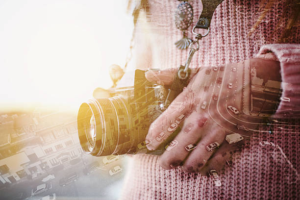 istock Old camera in hand with cityscape 638029972