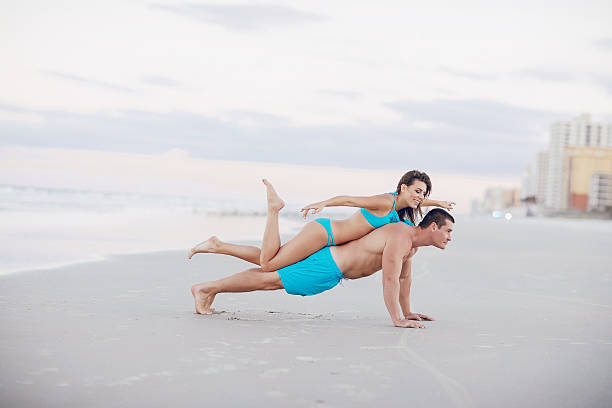 istock beautiful couple on the beach 638030330