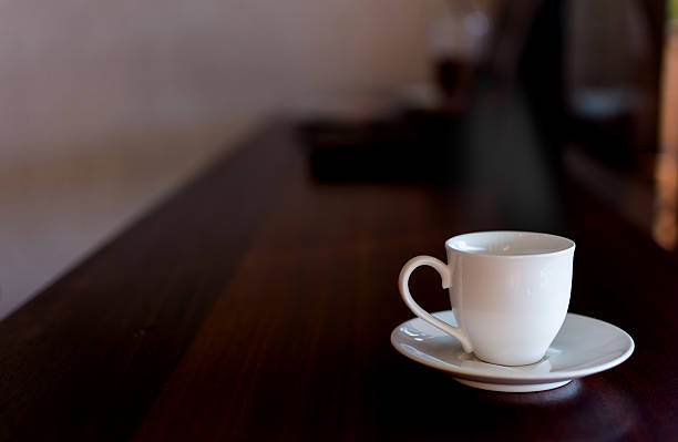istock Cup of coffee on table on blured cafe background. 638034334